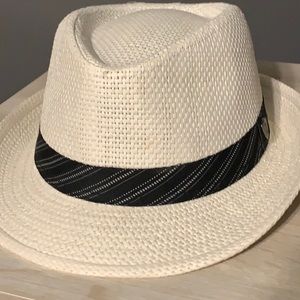 White fedora with black striped band